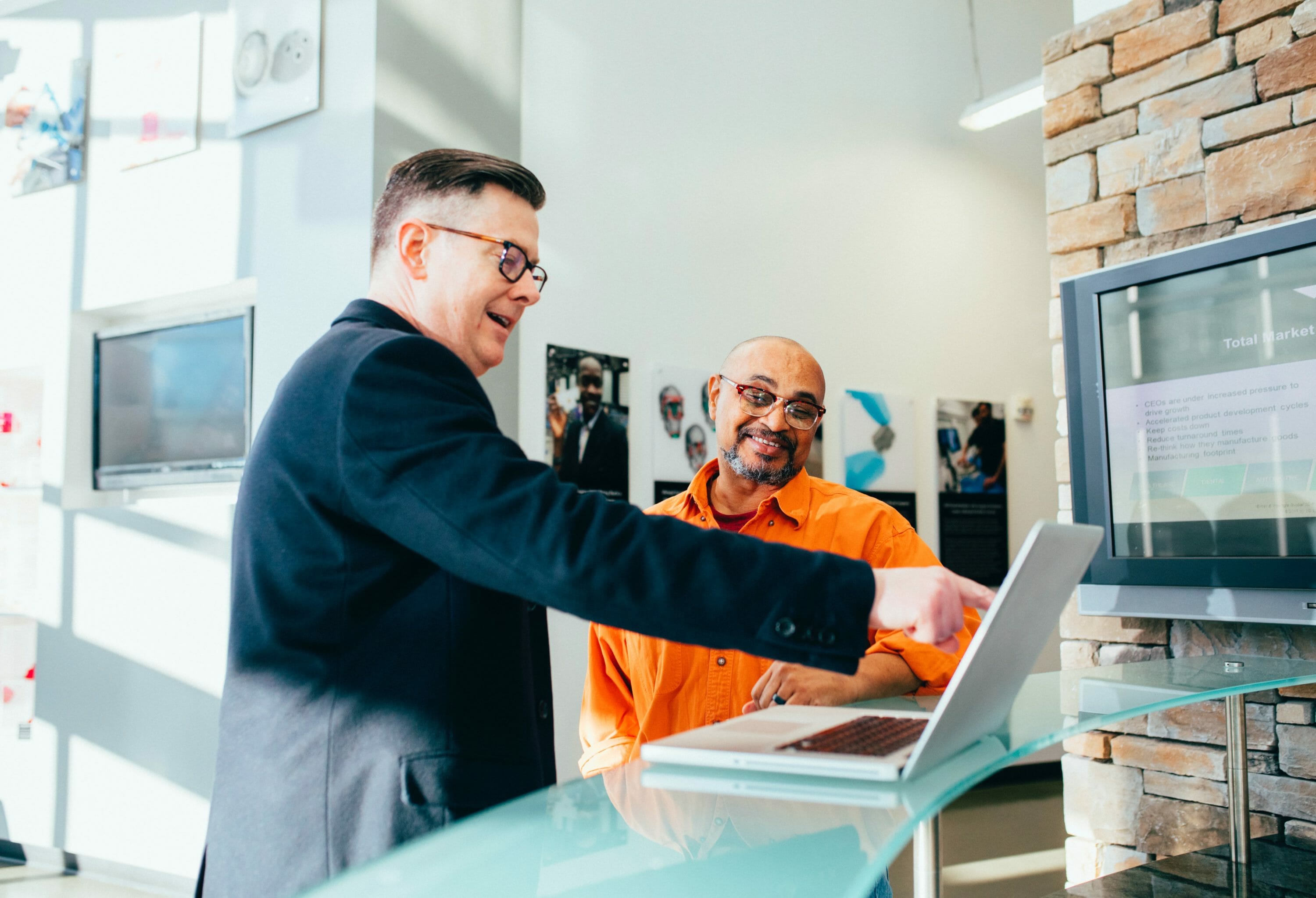 a web designer showing his client the website