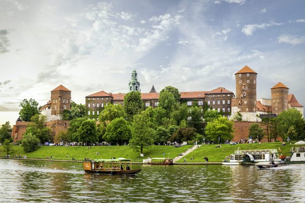 CRACOW ( KRAKOW ) POLAND - MAY 09 2015: Panorama of antique royal Wawel castle and Vistula river in Cracow ( Krakow ) Poland